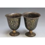 A PAIR OF CONTINENTAL CLOISONNE STYLE GOBLETS, one slightly smaller than the other and the