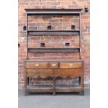 AN EARLY 19TH CENTURY OAK DRESSER OF SMALL PROPORTIONS WITH UNUSUAL TURNED SUPPORTS, having an