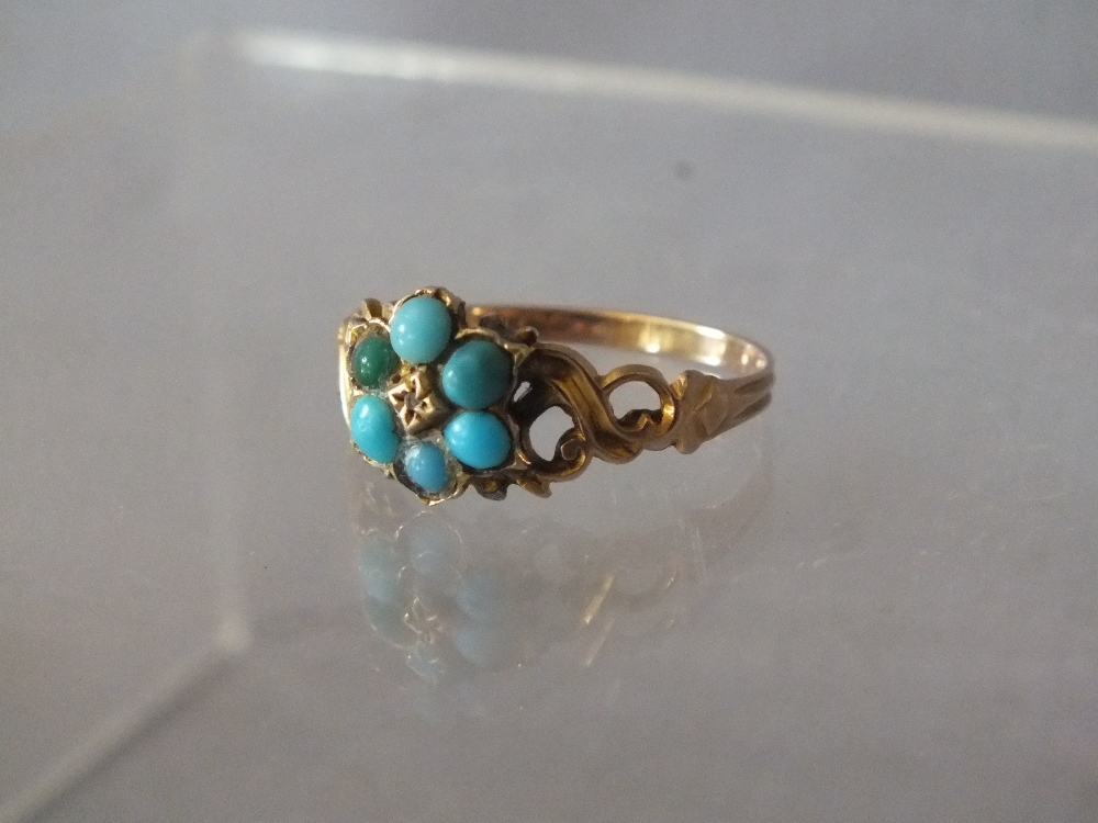 AN ANTIQUE TURQUOISE AND GEMSET YELLOW METAL RINGCondition Report:The earrings having slight damage - Image 2 of 2