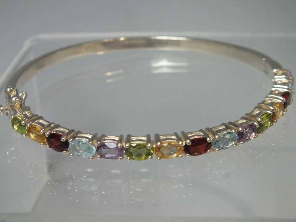 A HALLMARKED SILVER MULTICOLOURED GEMSET SILVER BANGLE, together with two further gemset silver - Image 3 of 4