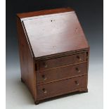 A MAHOGANY MINIATURE BUREAU, H 36 cmCondition Report:arm handles absent