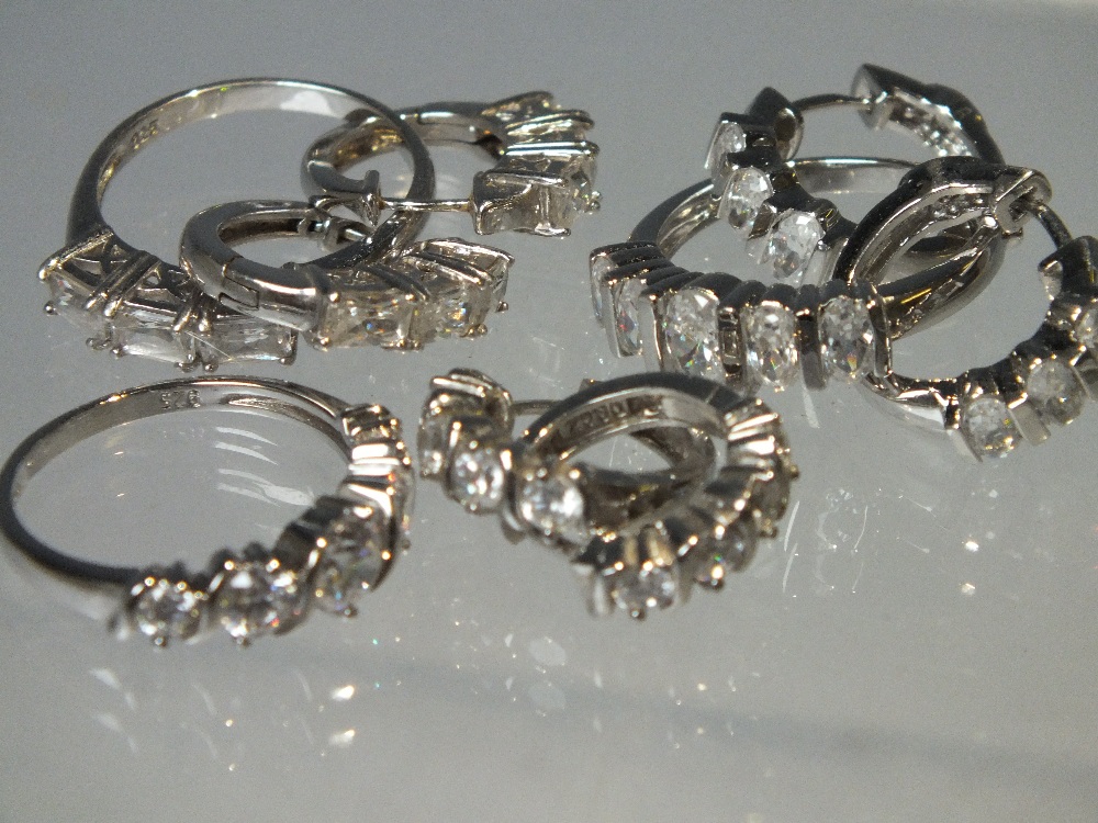 THREE PAIRS OF SILVER AND CZ EARRINGS TOGETHER WITH MATCHING RINGS, mostly QVC Diamonique