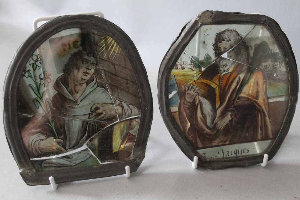 TWO UNUSUAL ANTIQUE STAINED GLASS PANELS DEPICTING 'ST. JACQUES' AND ANOTHER RELIGIOUS FIGURE,