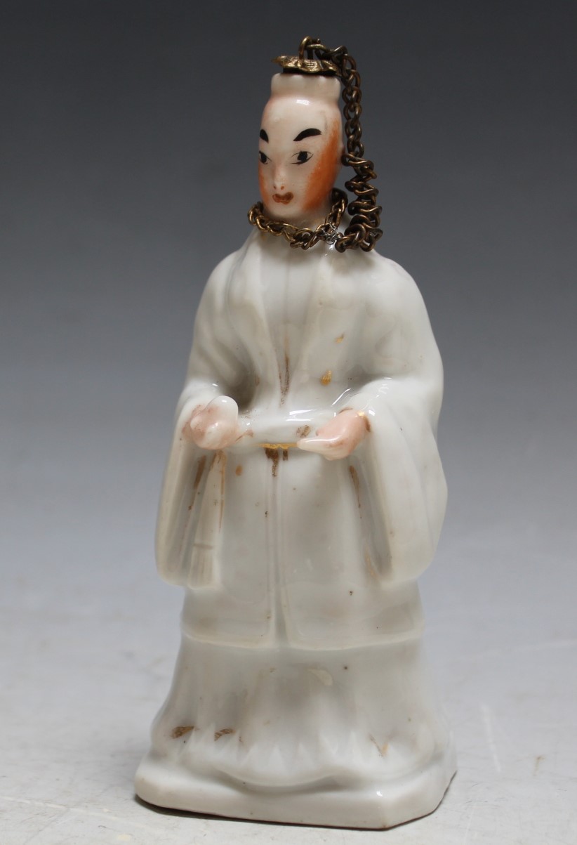 A NOVELTY PORCELAIN SCENT BOTTLE, modelled as an oriental figure, H 12 cm