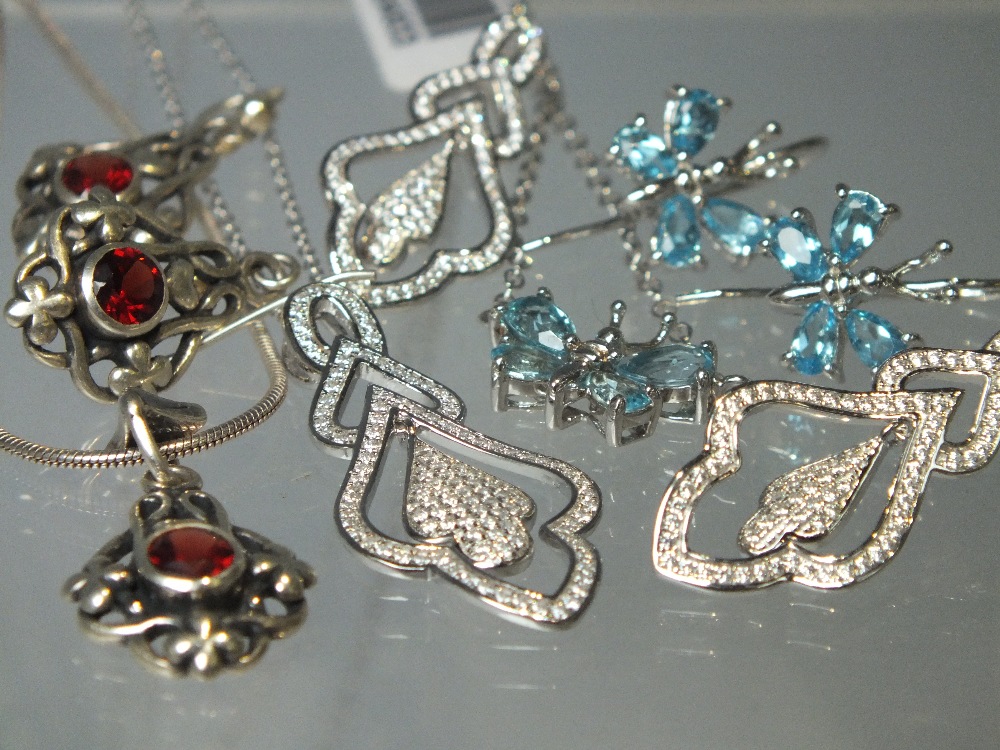 A COLLECTION OF SIX MODERN SILVER PENDANT AND EARRINGS JEWELLERY SETS, to include QVC Diamonique