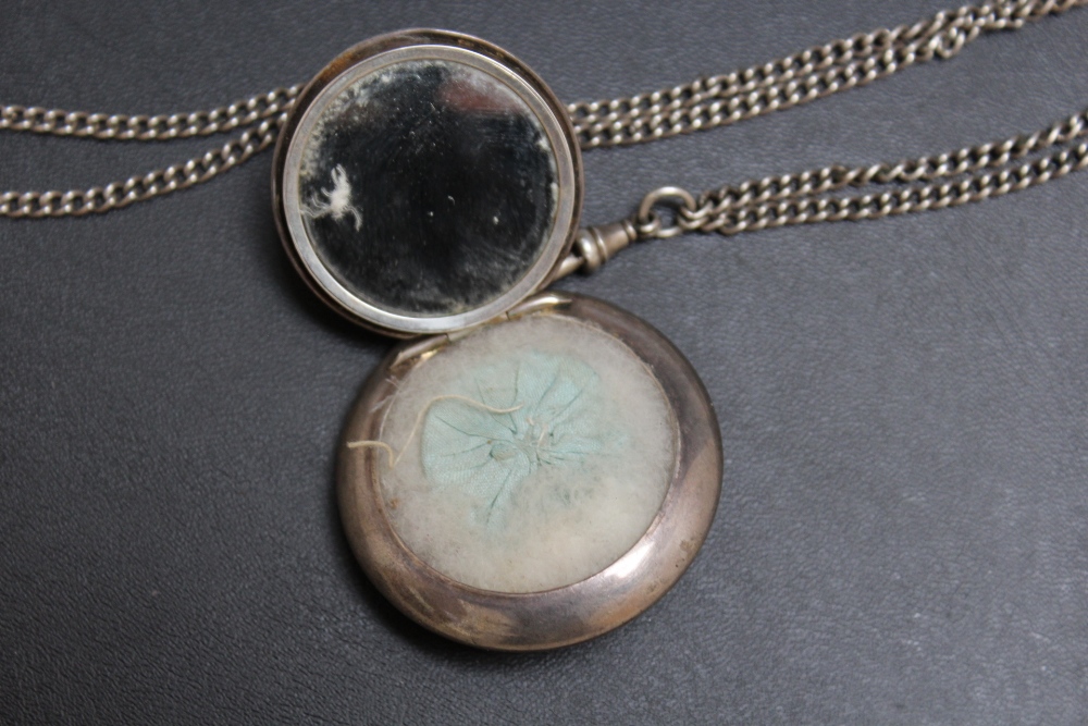 A HALLMARKED SILVER PENDANT MIRRORED COMPACT BY ZIMMERMANN, with powder puff, on unmarked white - Image 2 of 3