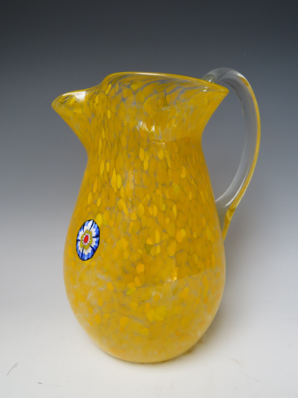 A VENETIAN MURANO GLASS LARGE PITCHER / LEMONADE JUG, embellished with a single millefiori cane