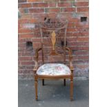 AN EDWARDIAN MAHOGANY INLAID ARMCHAIR, with satinwood inlaid detail throughout, raised on tapered