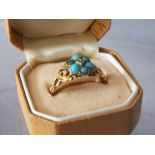 AN ANTIQUE TURQUOISE AND GEMSET YELLOW METAL RINGCondition Report:The earrings having slight damage