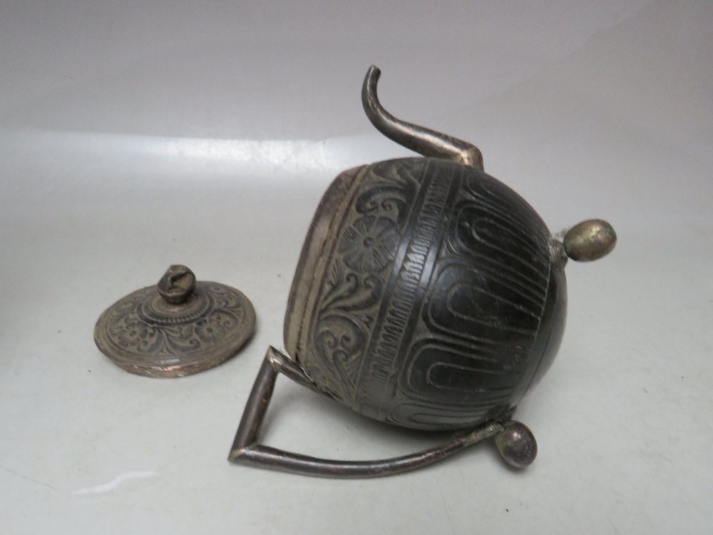 A 19TH CENTURY CARVED COCONUT SHELL AND LID, raised on a white metal covered support, H 23 cm, - Image 9 of 10