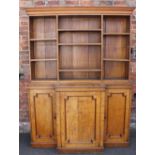 A 19TH CENTURY OAK BREAKFRONT LIBRARY BOOKCASE, the flat open fronted upper section with a range