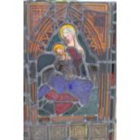A TALL RECTANGULAR STAINED LEADED GLASS CHURCH WINDOW PANEL, depicting Mary with baby Jesus, a