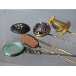 A SELECTION OF FIVE ASSORTED VINTAGE STICK PINS, to include an oval goldstone example, pietra dura