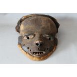 A 20TH CENTURY AFRICAN TRIBAL WOODEN MASK WITH HEAD COVERING, mask H 19 cm, W 16 cm