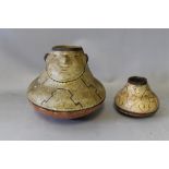 TWO SOUTH AMERICAN PERUVIAN SHIPIBO PAINTED TERRACOTTA STORAGE POTS, the larger one with