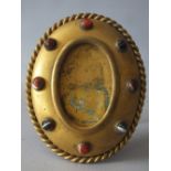 AN ANTIQUE GILT METAL OVAL PICTURE FRAME, having various polished agate cabochon embellishments to