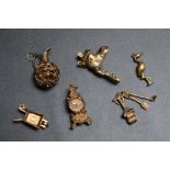 A COLLECTION OF NOVELTY CHARMS, consisting of hallmarked gold and unmarked yellow metal examples,