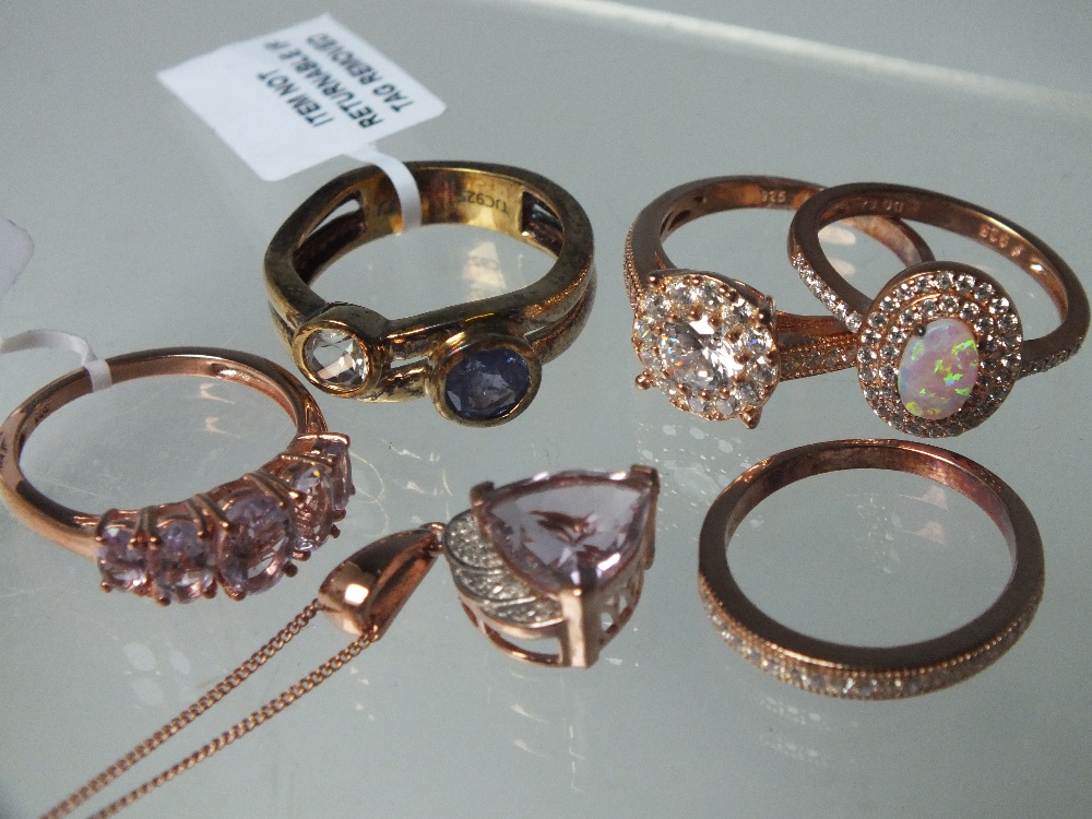 A COLLECTION OF MOSTLY ROSE GOLD TONE GEMSET SILVER JEWELLERY ITEMS ETC, comprising five rings, a