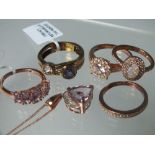 A COLLECTION OF MOSTLY ROSE GOLD TONE GEMSET SILVER JEWELLERY ITEMS ETC, comprising five rings, a