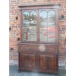 A REGENCY MAHOGANY SECRETAIRE BOOKCASE, having a twin glazed door, upper section above a fitted