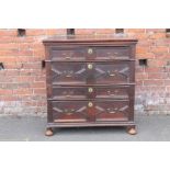 AN ANTIQUE JACOBEAN STYLE OAK CHEST OF FOUR DRAWERS, each drawer with typical geometric moulded