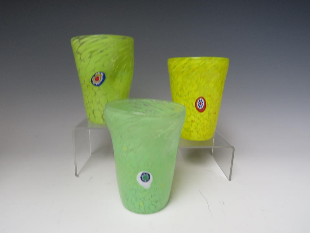 A SET OF THREE VENETIAN MURANO DRINKING GLASSES, comprising three freeform tumblers, finished in