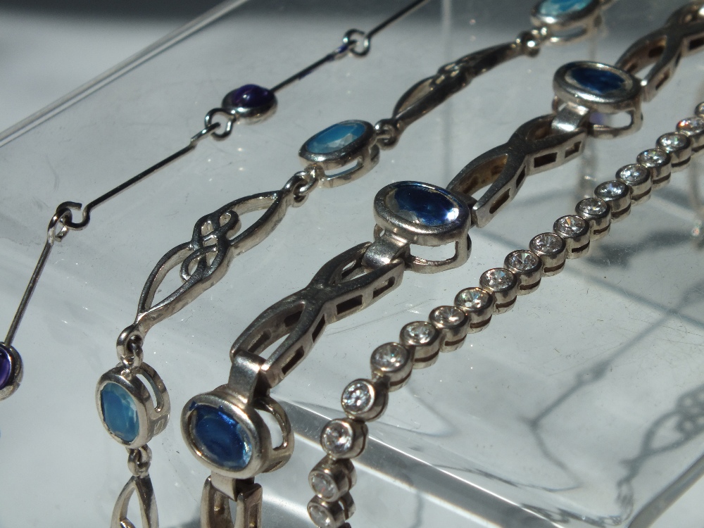 THREE MODERN SILVER GEMSET BRACELETS, to include a diamante set tennis bracelet, together with an - Image 2 of 2