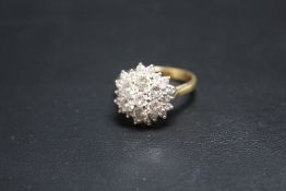 AN 18CT GOLD DIAMOND CLUSTER RING, set with an estimated 2 carats of brilliant cut diamonds, ring