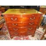 A MAHOGANY SERPENTINE FRONTED TELEVISION CABINET IN THE FORM OF A CHEST H-88 W-92 CM