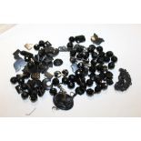 A QUANTITY OF LOOSE JET TYPE BEADS ETC.