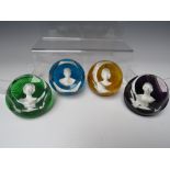 A SET OF FOUR BACCARAT CRYSTAL ROYALTY CAMEO / PORTRAIT PAPERWEIGHTS, comprising HM Queen