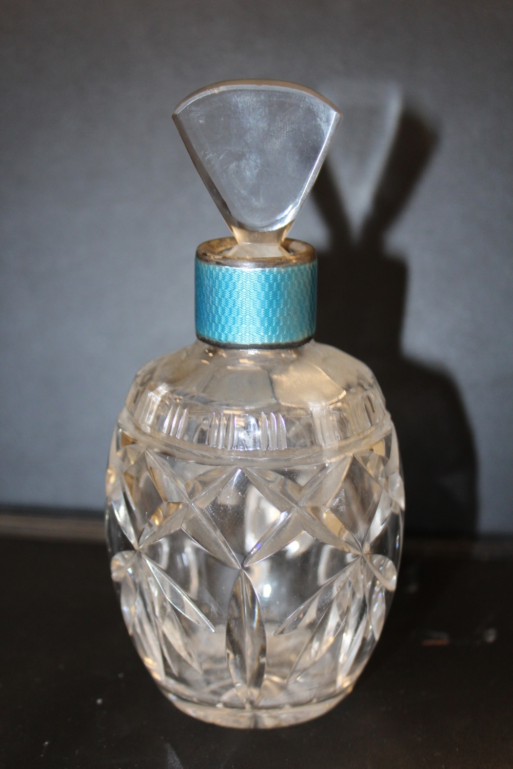 A SILVER AND ENAMEL MOUNTED GLASS SCENT BOTTLE