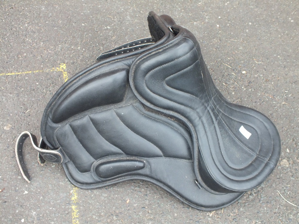 A BLACK LEATHER HORSE SADDLE