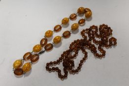 TWO RETRO AMBER STYLE BEADED NECKLACES