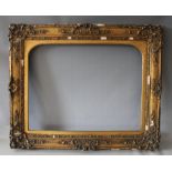 A 19TH CENTURY GOLD SWEPT FRAME, with arched gold slip (in need of restoration), frame W 9 cm,