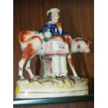 AN ANTIQUE STAFFORDSHIRE STYLE FLATBACK FIGURE OF A LADY AND A COW H-20CM