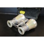 A PAIR OF LEATHER CASED MOTHER OF PEARL OPERA GLASSES
