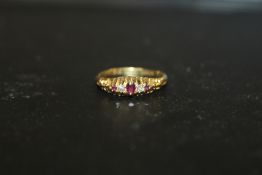 A HALLMARKED GOLD FIVE STONE RUBY AND DIAMOND RING - RESTORED OVER HALLMARK APPROX WEIGHT - 3.1G