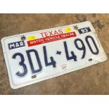 A VINTAGE ENAMELLED TEXAS LICENCE PLATE / NUMBER PLATE