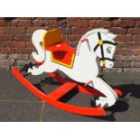 A HAND PAINTED WOODEN ROCKING HORSE - L 100 CM