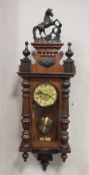 A 19TH CENTURY VIENNA WALLCLOCK WITH HORSE FINIAL, overall H 99 cm, W 30 cm