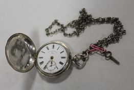 A CHESTER HALLMARKED SILVER FULL HUNTER POCKET WATCH ON CHAIN BY THOMAS RUSSELL AND SON