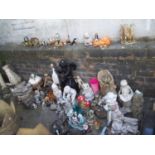 A LARGE SELECTION OF GARDEN ORNAMENTS TO INCLUDE PLASTIC, CONCRETE AND CERAMIC EXAMPLES