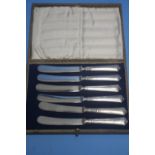 A CASED SET OF SIX HALLMARKED SILVER KNIVES