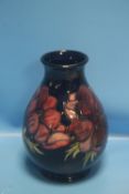 A MOORCROFT VASE, ANEMONE PATTERN H 19 CM