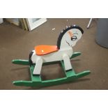 A WOODEN CHILD'S ROCKING HORSE