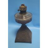 A VINTAGE PARAFFIN LAMP, ELEPHANT DECORATION TO BASE