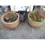 A PAIR OF LARGE TERRACOTTA PLANTERS