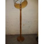 A FLOOR STANDING STANDARD LAMP AND SHADE