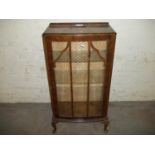 A NARROW WALNUT CHINA CABINET